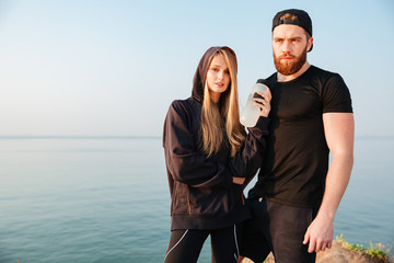 Portrait of a sports couple after running workout outside