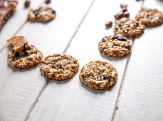 Set of sweets. Chocolate bars and granola on a wooden background
