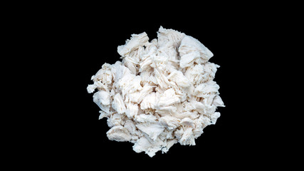 Boiled chicken meat on a black background.