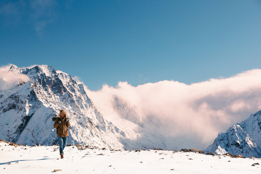 Hiker in mountains in winter