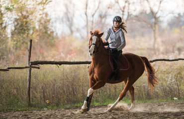 Young girl riding a horse