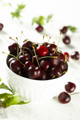 Fresh cherries in white bowl