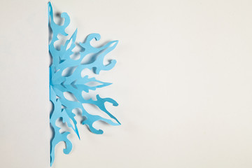 Fine paper snowflake cut out.