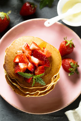 American pancakes with fresh strawberry and honey