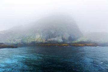 Fototapeta na wymiar Majestic sea and rocks in heavy fog
