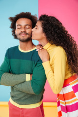 Obraz premium Beautiful tender african young couple standing and kissing