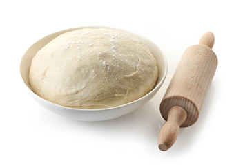 bowl of fresh dough and rolling pin