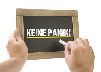 Keine Panik! / Hand schreibt auf Kreidetafel