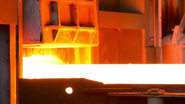hot steel on conveyor in steel plant mill