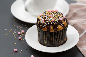 Chocolate muffin and cup of coffee, selective focus