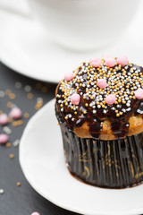 Chocolate muffin and cup of coffee