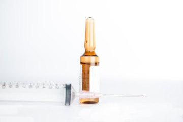 Brown ampule and injection syringe