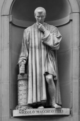 Statue of Italian Renaissance diplomat and writer Niccolo Machiavelli outside the Uffizi Gallery in Florence, Italy.