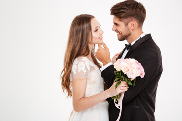 Close up portrait of couple with bouqute