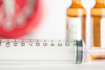 Injection syringe and brown ampule background