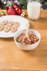 The white plate of the gingerbread man on the wooden table and C