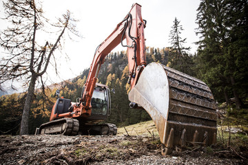 Excavator working on a mountains.