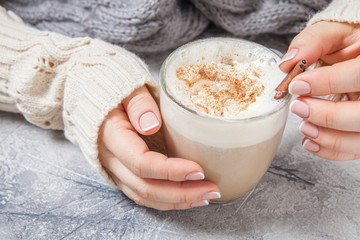 woman hands with a latte
