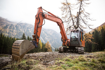 Excavator working on a mountains.