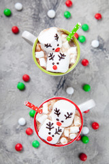 Christmas mugs hot chocolate with melted marshmallow reindeers