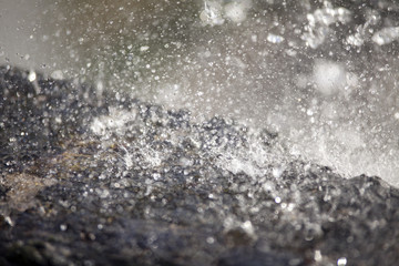 water splash on rock