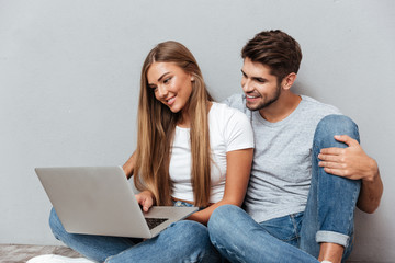Happy couple with laptop