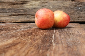 Red Apple Close up,select focus with shallow depth of field wooden floor background