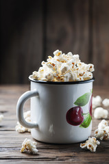 Popcorn on the wooden table