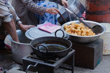 fried nepali food selling at street shop