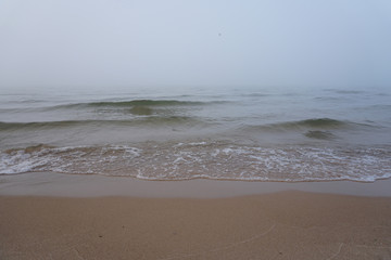 Fog over big lake on cold November morning