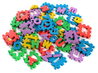 Cut out letters of toy plastic alphabet puzzle