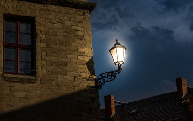 The old building against sky in city and glowing lantern