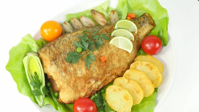 baked fish with salad on white  plate 