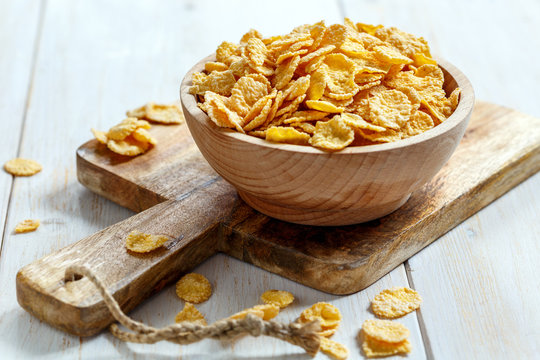 Corn flakes in a wooden bowl.