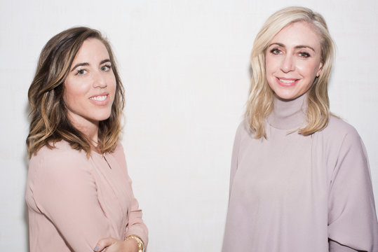 Portrait of two mid adult female psychologists