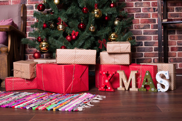 Many  Christmas gifts in the package under the tree