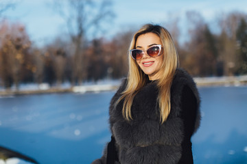 Portrait of a glamorous business woman in the winter street.