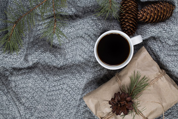 New Year's background. coffee and Christmas toys and warm scarves.