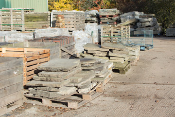 Reclamation yard background: stacks of paving slabs, selecive focus