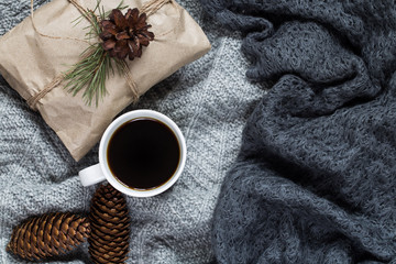 Obraz na płótnie Canvas New Year's background. coffee and Christmas toys and warm scarves.