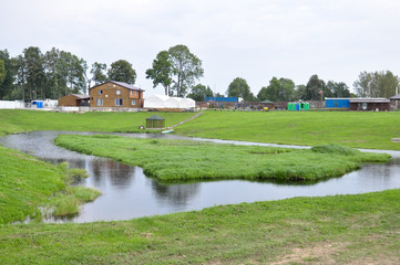 Fototapeta na wymiar village and pond