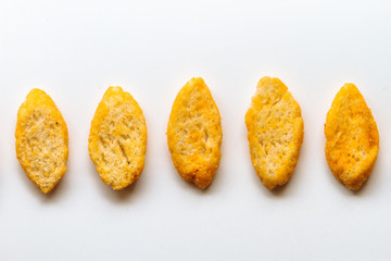 Five toast with olive oil viewed from above on white background