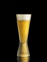glass of beer on a black background