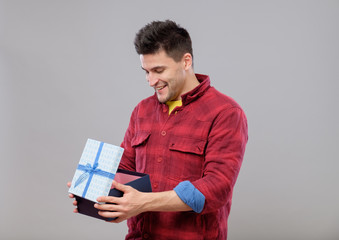 Happy young man with a gift