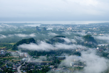 Krabi morning with mist and mountain.