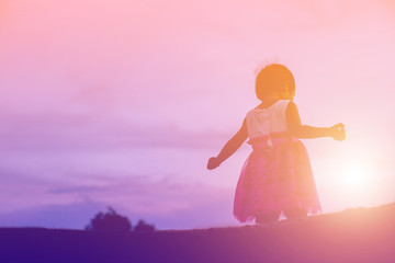 kid silhouette,Moments of the child's joy. On the Nature sunset
