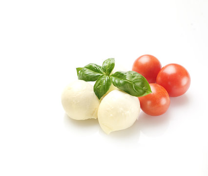 mozzarella, basil and cherry tomatoes on a white background