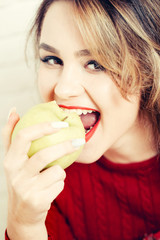 sexy girl eating green apple