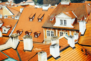 Terracotta tiled roofs with chimneys