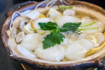 Traditional Shimabara Guzoni - soup with rice cake and seafood